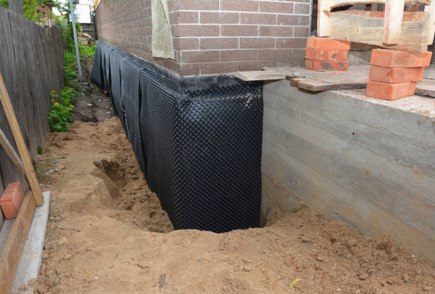 Happy homeowners after waterproofing job in Thurston